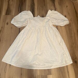 Medium White puff sleeved dress with subtle floral detail